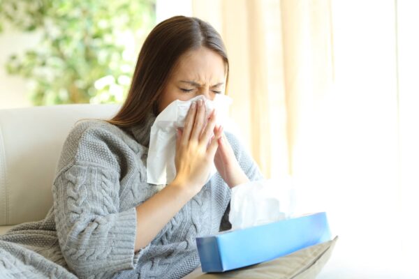 Allergies and Asthma. Woman with tissues for allergies.