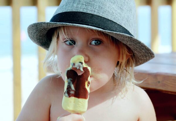 Sugar Bomb. Child eating ice cream.